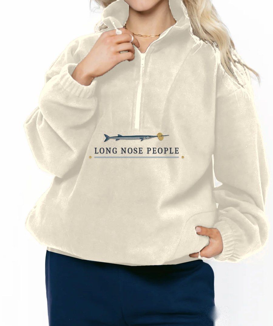 Anguilla ecru fleece quarter zip with an embroidered needlefish and Long Nose People lettering under the zip