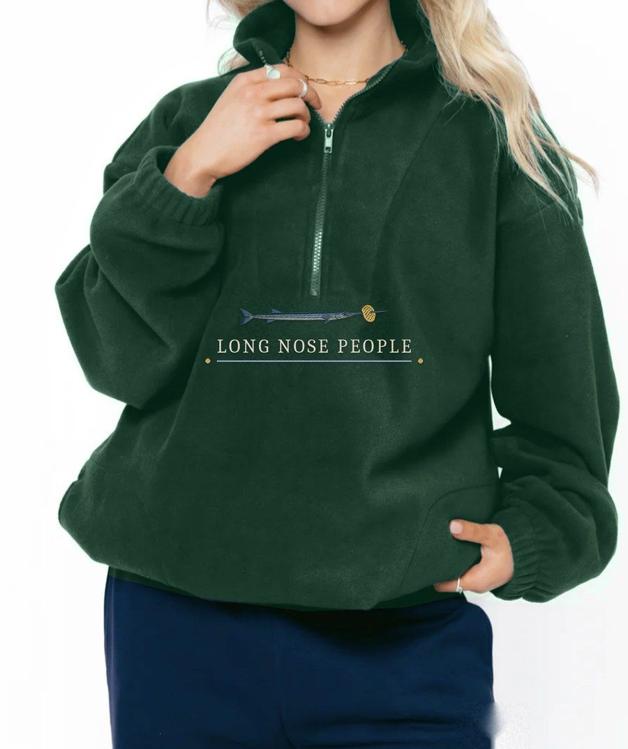 Nevis racing green fleece quarter zip with an embroidered needlefish and Long Nose People lettering under the zip
