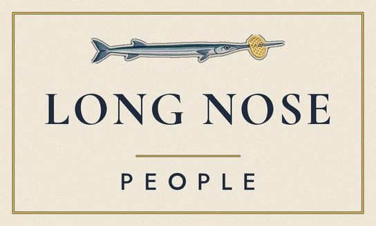 Navy woven neck label reading Long Nose People with a small needlefish