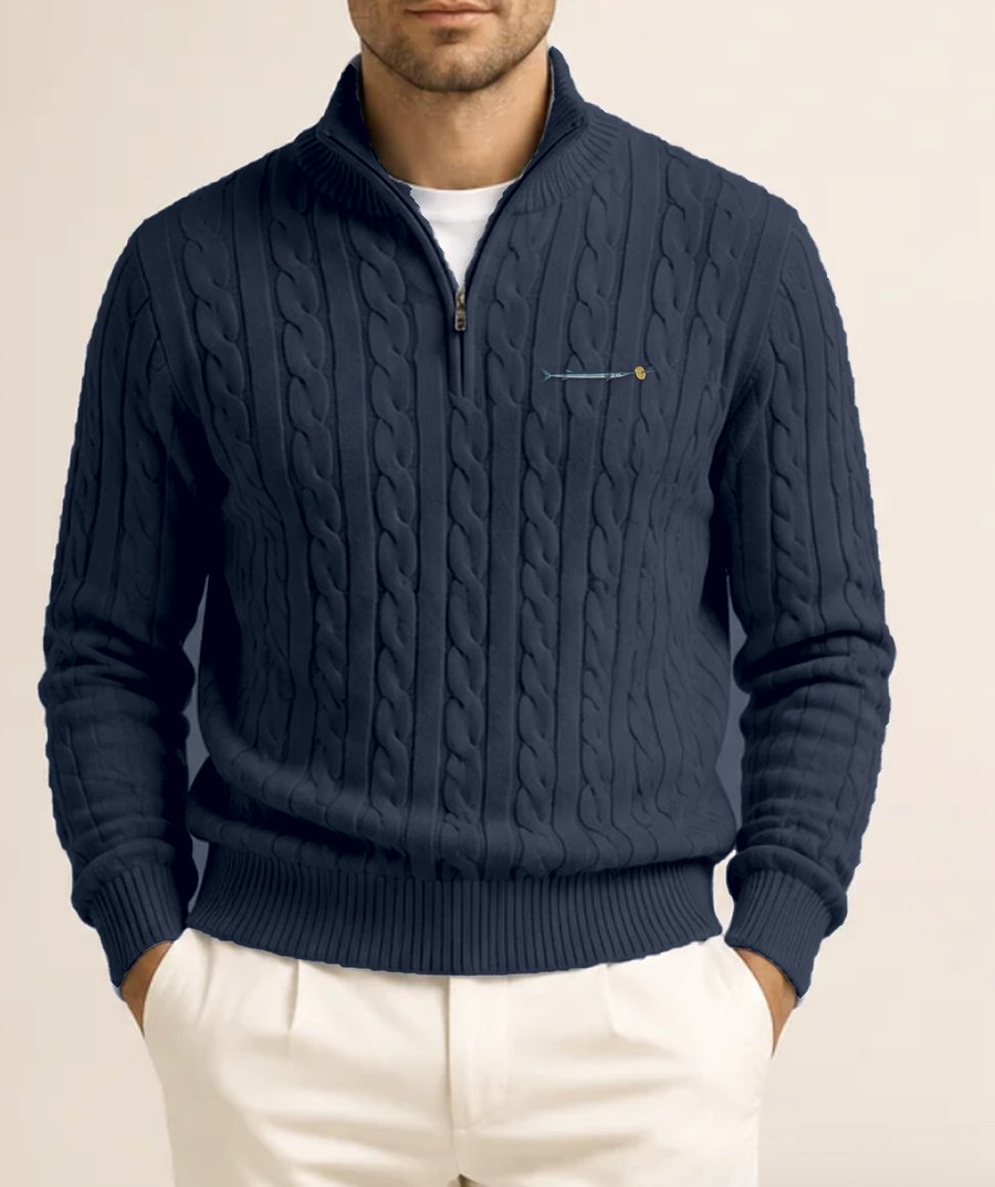 Navy cable-knit quarter zip jumper with a small embroidered needlefish and lattice crisp on the chest