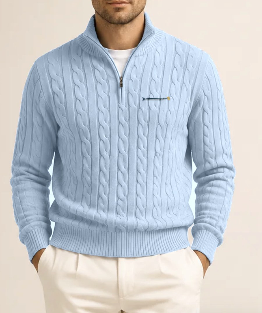 Sky Blue cable-knit quarter zip jumper with a small embroidered needlefish and lattice crisp on the chest
